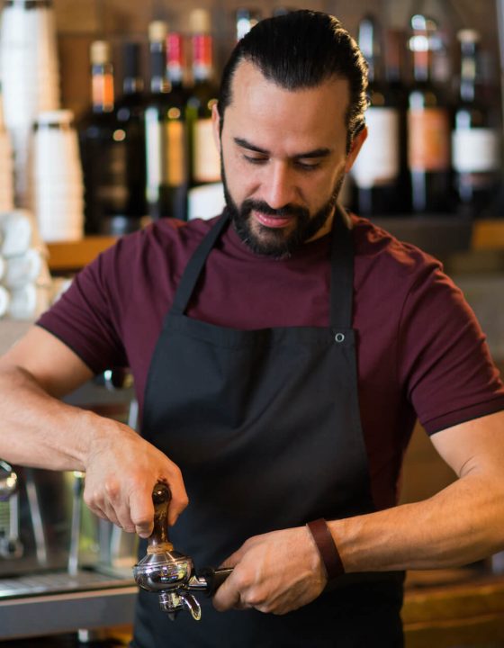 barista-man-making-espresso-at-bar-or-coffee-shop-2022-12-16-09-39-23-utc.jpg